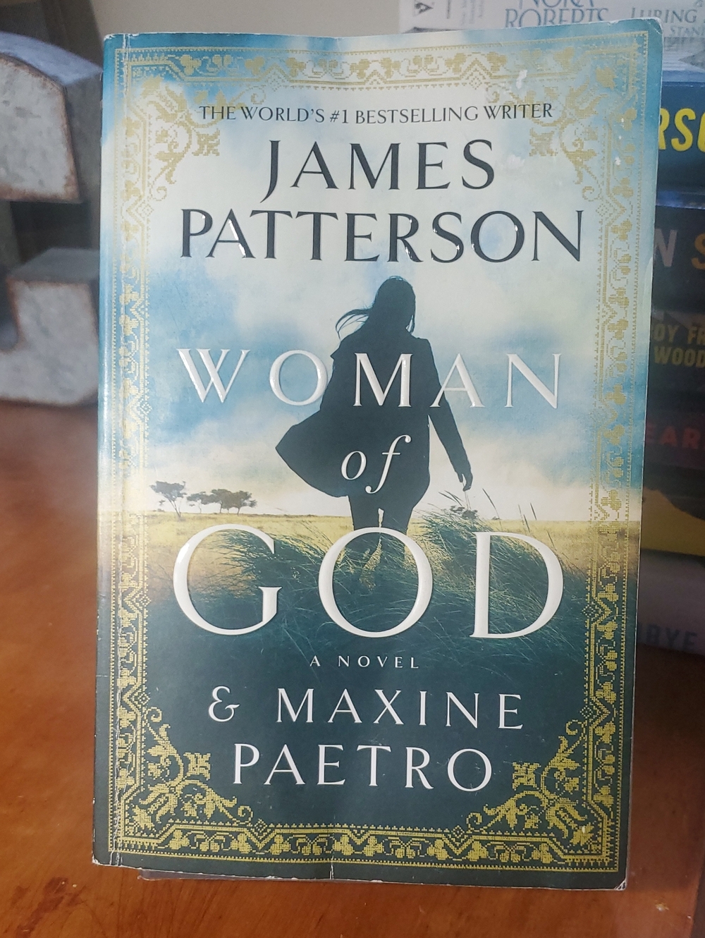 Paperback Blue Green Gold "Woman of God" By James Patterson Coffee Table Book